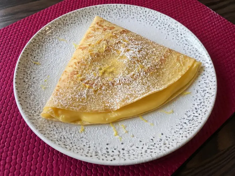 Lemon cream pie crêpe in the shop's plating style